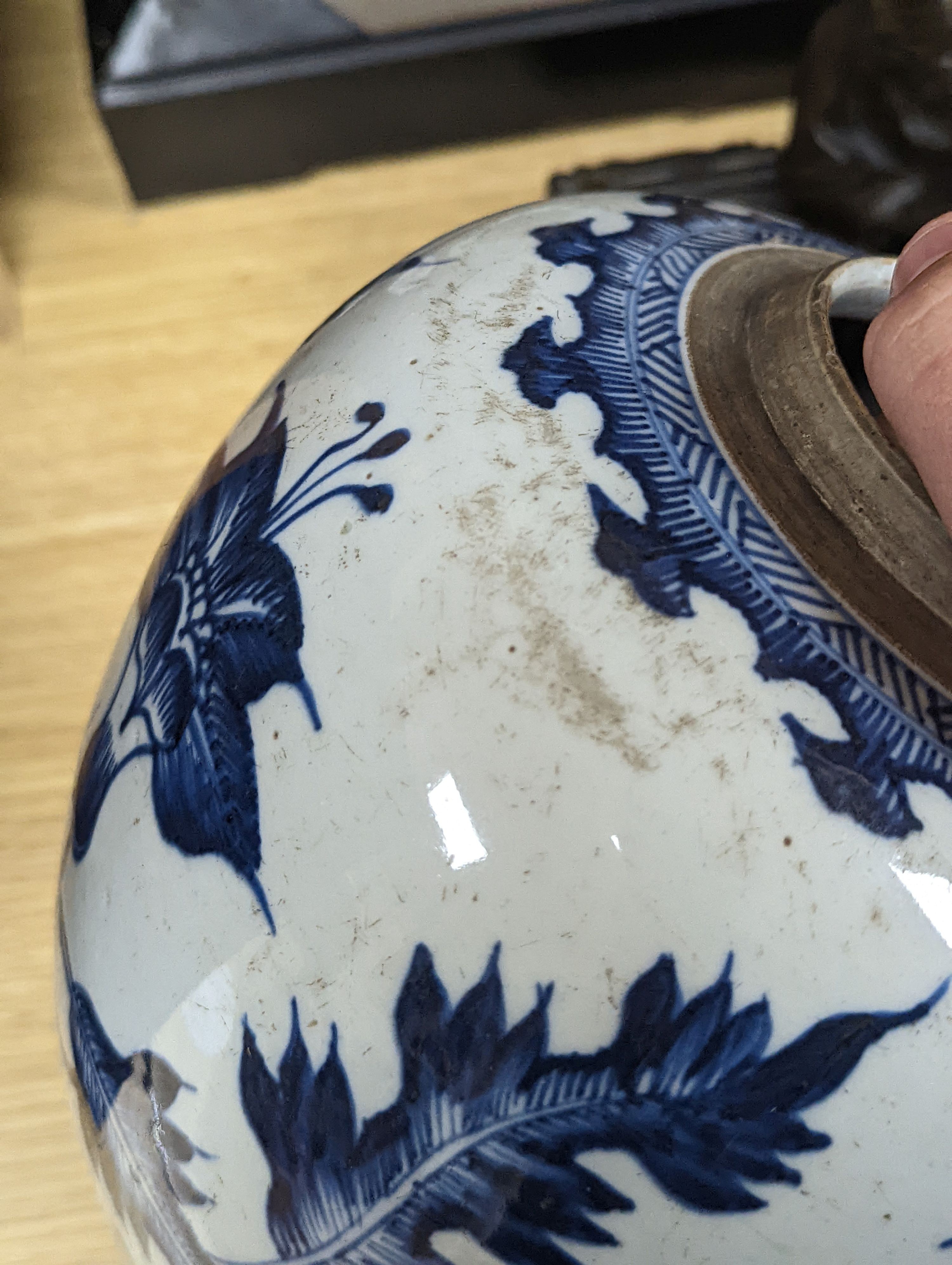 A 18th/19th century Chinese blue and white jar and wood cover - 22cm high